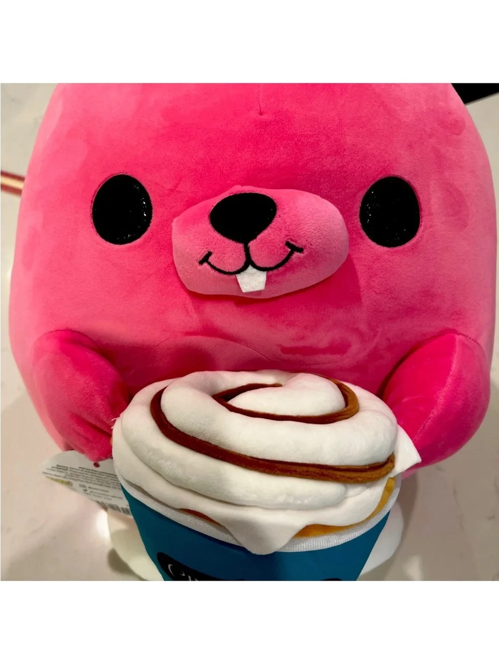 SNACKLES 14” Pink Bunny Super Plush Toy holding a Cinnabon Cinnamon Roll By Zuru